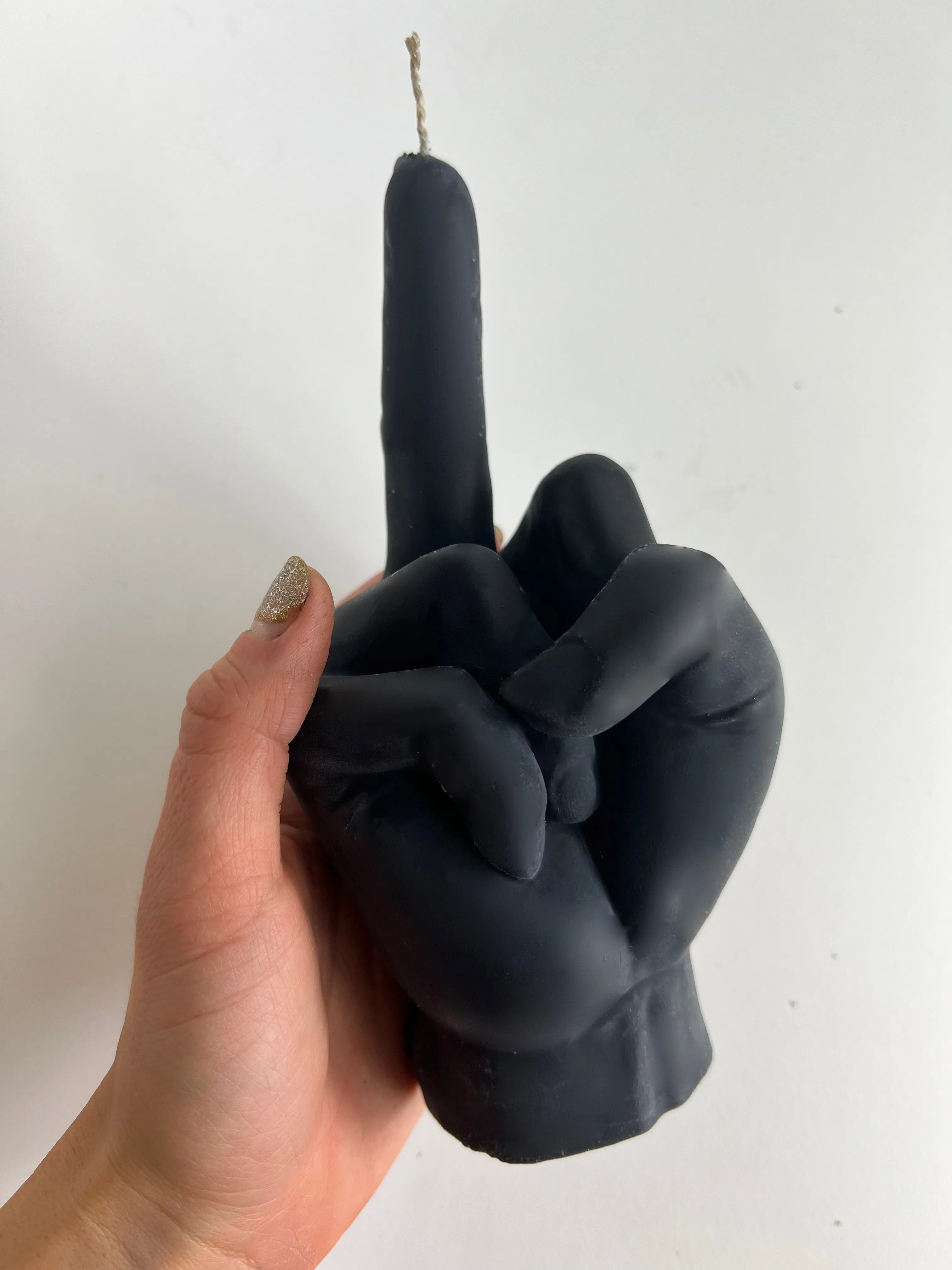 Middle Finger Candle  FLIP OFF sign wax art, protest, defiance, expression, humor, statement, controversy, bold, irreverent, dissent, unconventional art