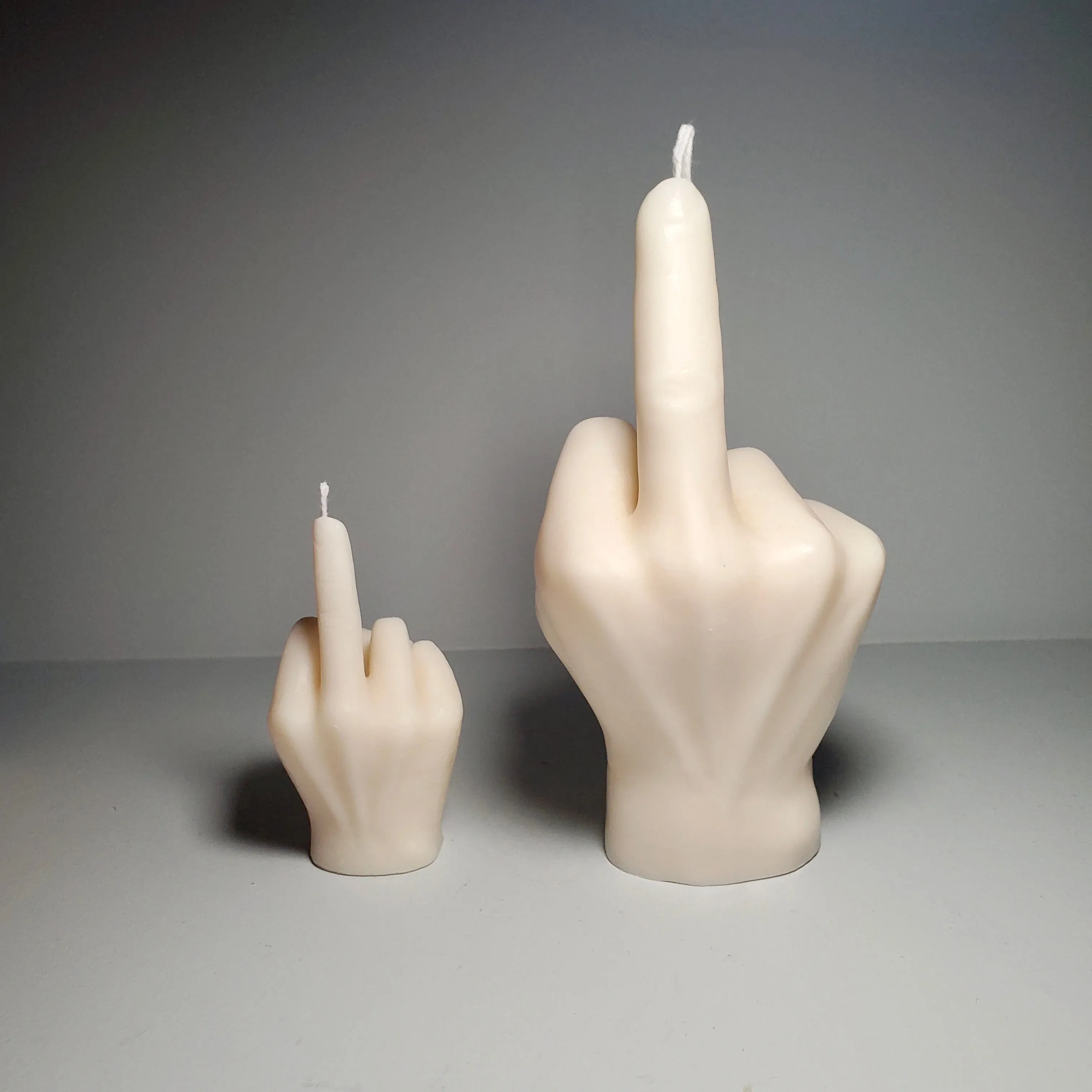 Middle Finger Candle  FLIP OFF sign wax art, protest, defiance, expression, humor, statement, controversy, bold, irreverent, dissent, unconventional art