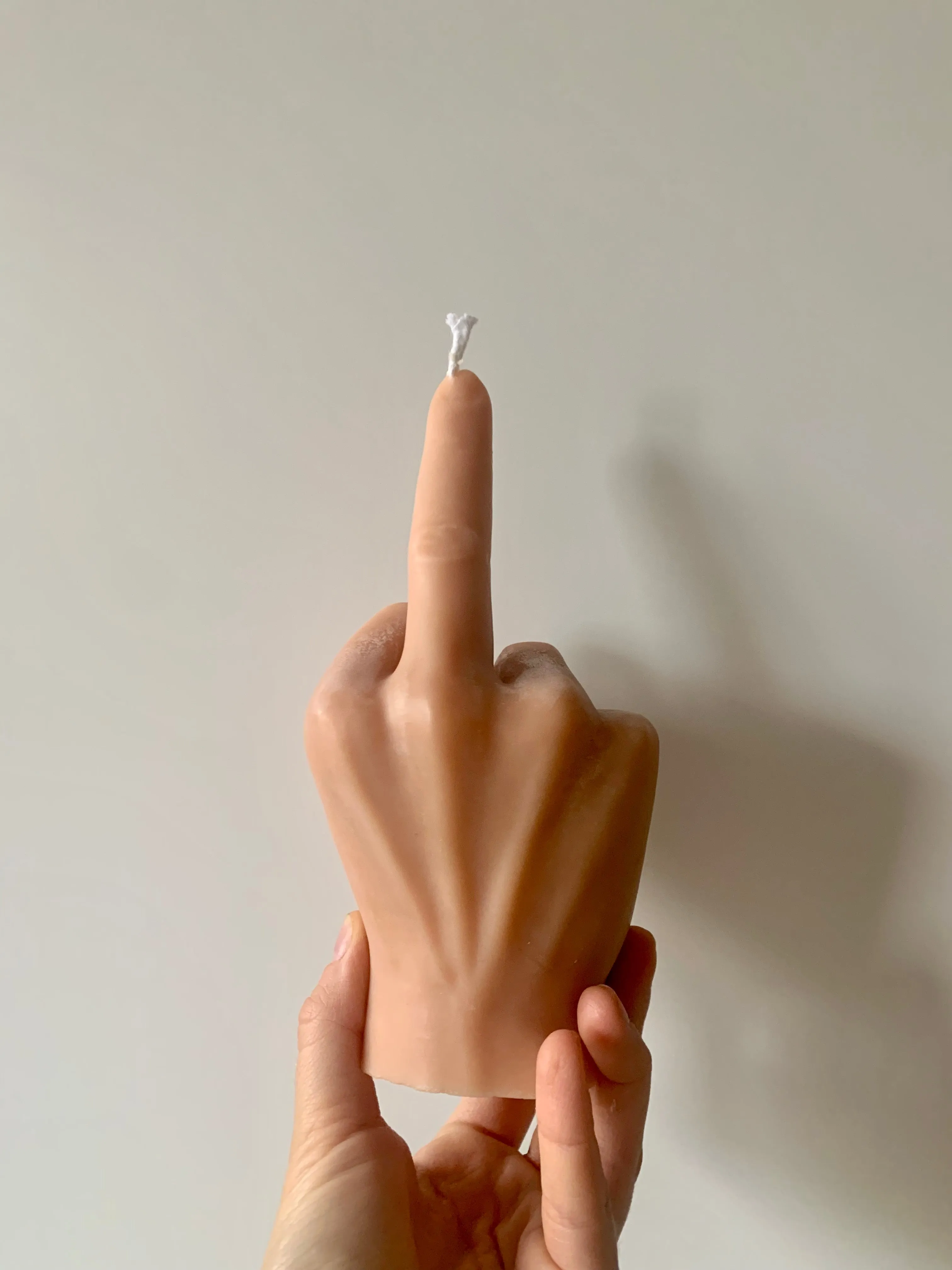 Middle Finger Candle  FLIP OFF sign wax art, protest, defiance, expression, humor, statement, controversy, bold, irreverent, dissent, unconventional art